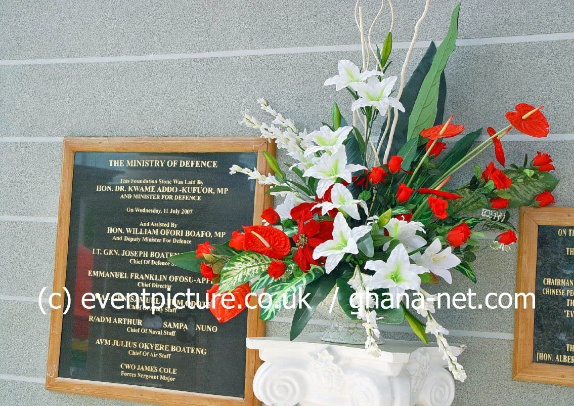 Inauguration plaque of the Ministry of Defence in Accra surrounded by flowers