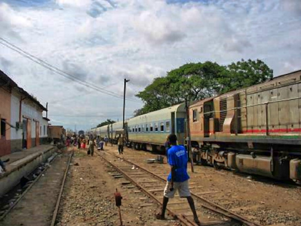 Train at Accra station with a man on the tracks, around 2001