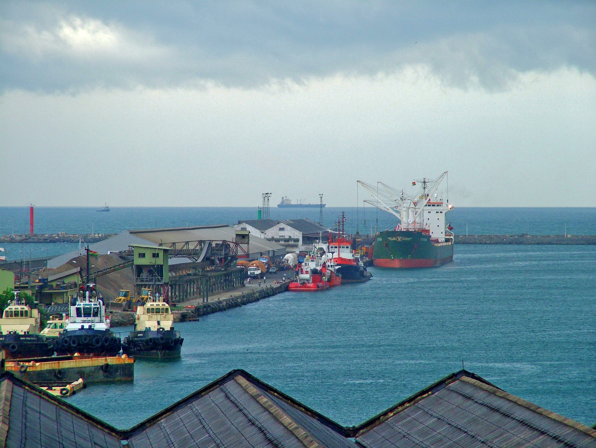 Takoradi harbour with one vessel in port and another at sea